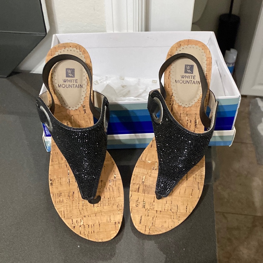 Beautiful shimmering black sandals with a cork heel